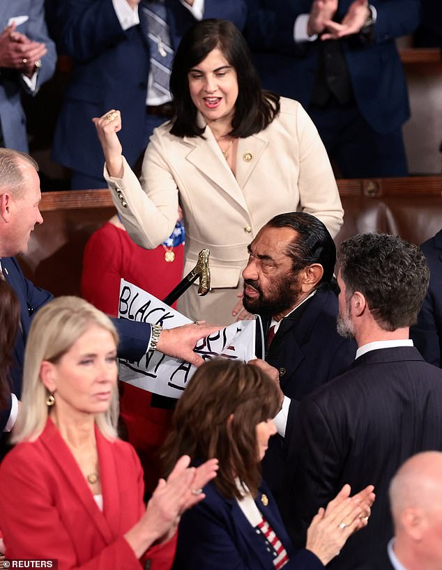 Al Green forcibly removed from Trump's State of the Union over protest sign criticizing AI-generated video