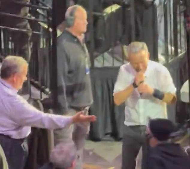Springsteen walks past Christie at concert, sparking viral snub rumors.