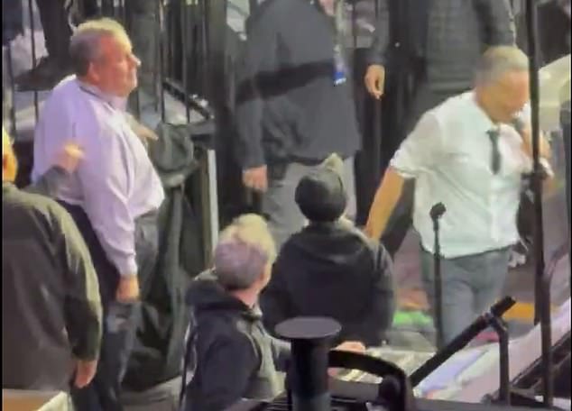 Springsteen walks past Christie at concert, sparking viral snub rumors.