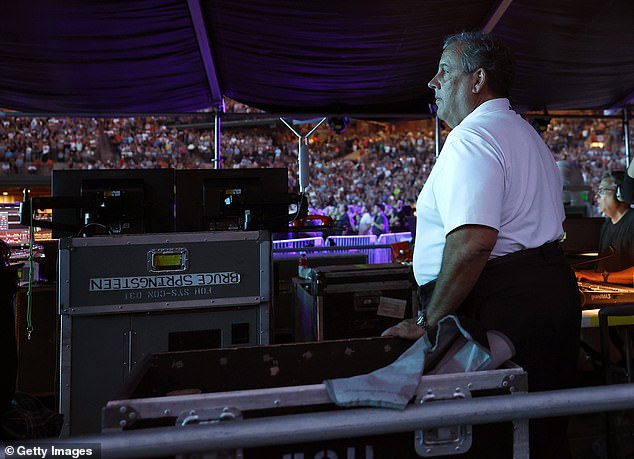 Springsteen walks past Christie at concert, sparking viral snub rumors.
