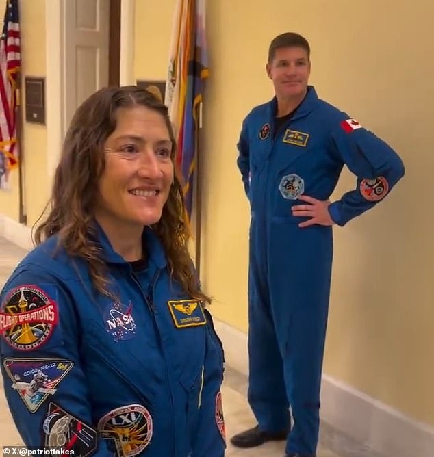 Conspiracy theorist confronts Artemis II astronauts on Capitol Hill, accusing them of faking spaceflight.