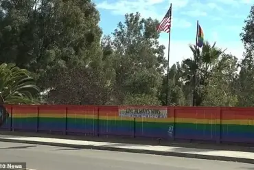 Lesbian woman's pride fence vandalized by homophobic teens