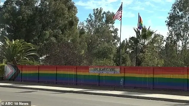 Lesbian woman's pride fence vandalized by homophobic teens