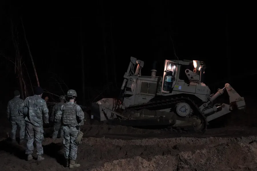 American Soldiers Engage in Unusual Rescue Mission to Retrieve M88 Hercules from Swamp in Eastern Europe