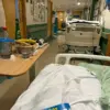 Hospital Patient Forced to Sleep on Corridor: Urgent Need for Bed Crisis Solutions